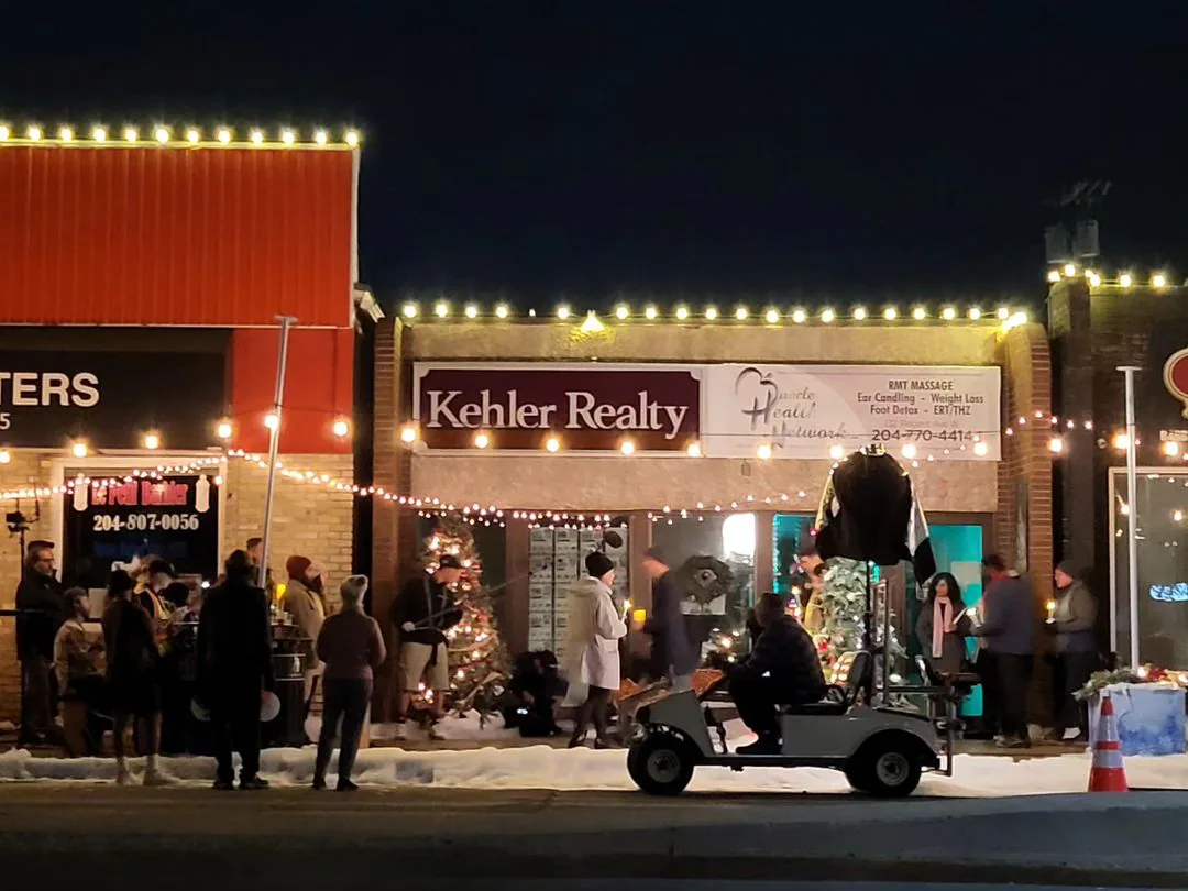 Storefront on Regent Avenue West in Transcona, Winnipeg, decorated with Christmas lights and fake snow for Five Gold Rings filming
